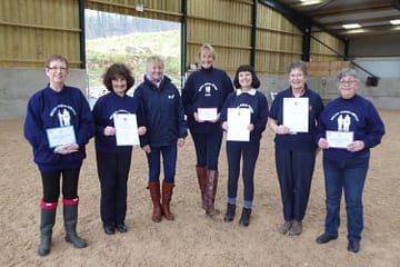 group of people showing their long service awards