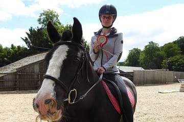 person sitting on a horse